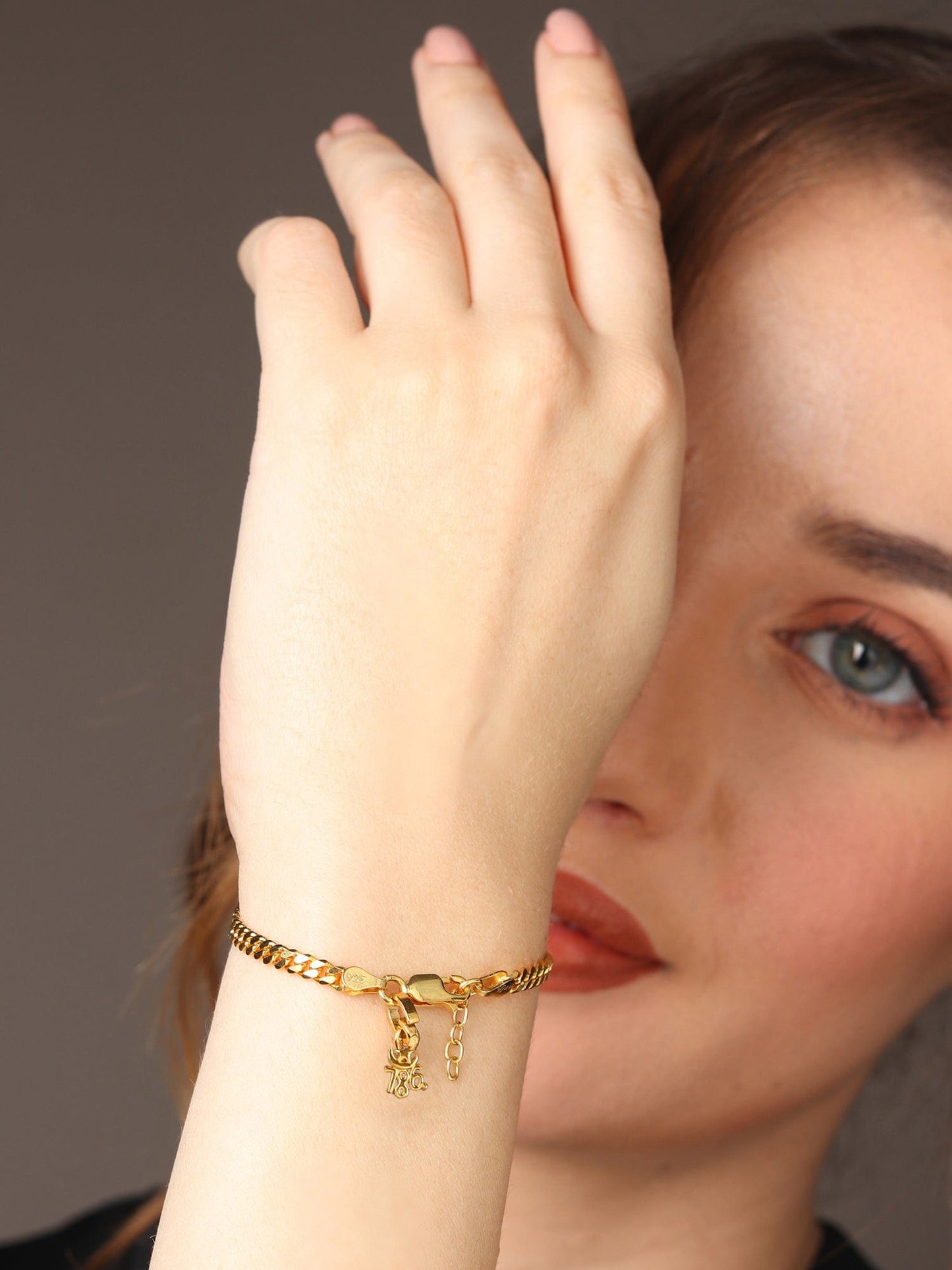 Akshat Sapphire 22KT gold plated 92.5% pure Sterling Silver Curb Designer Bracelet with religious 786 charm for Girls and Women